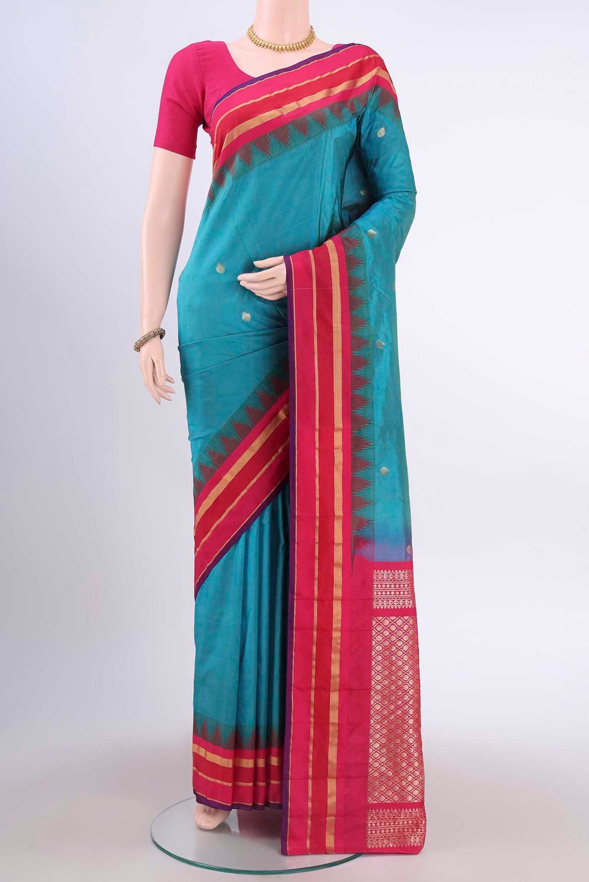Blue Blended Bangalore Silk Saree with Zari Butta on the body and Temple Border displayed on a mannequin