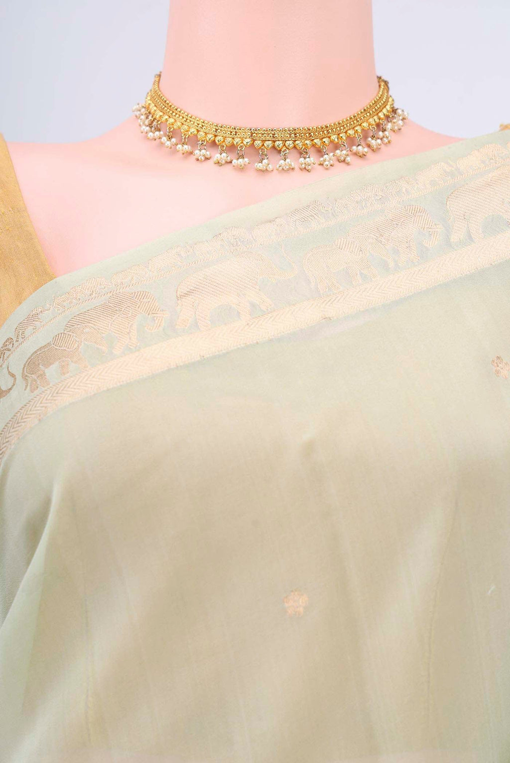 Border image of Mint Green Organza Silk Saree with Zari Butta on the body and Zari Border