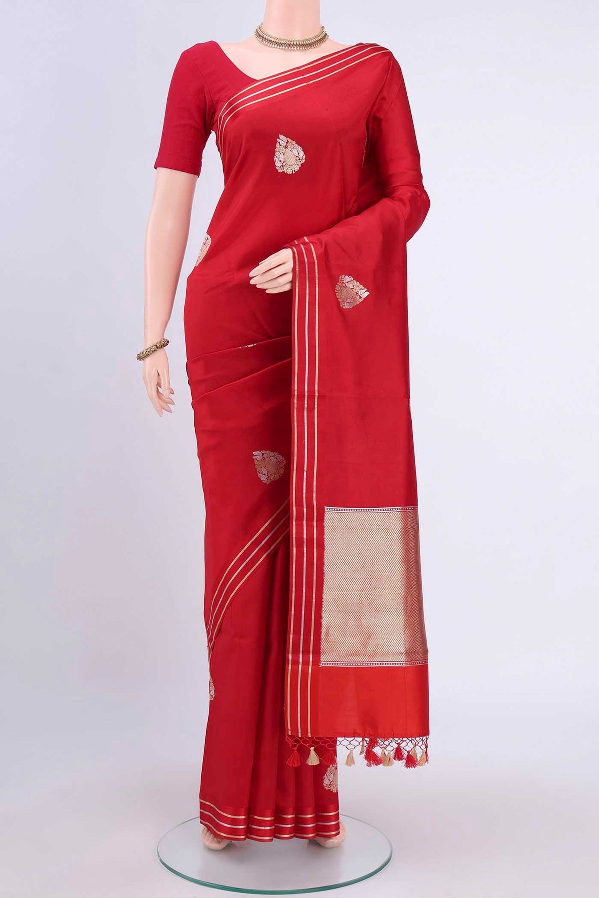 Red Banarasi Silk Saree with Zari Butta on the body and Satin Border displayed on a mannequin
