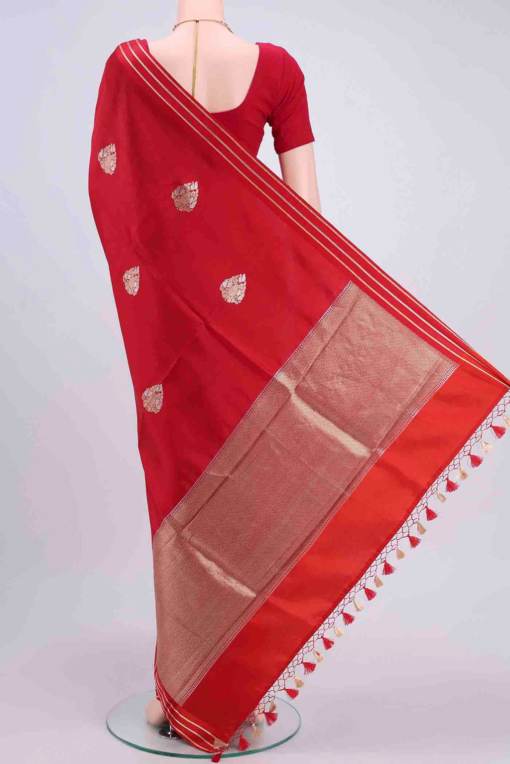 Flat view of Red Banarasi Silk Saree with Zari Butta on the body and Satin Border