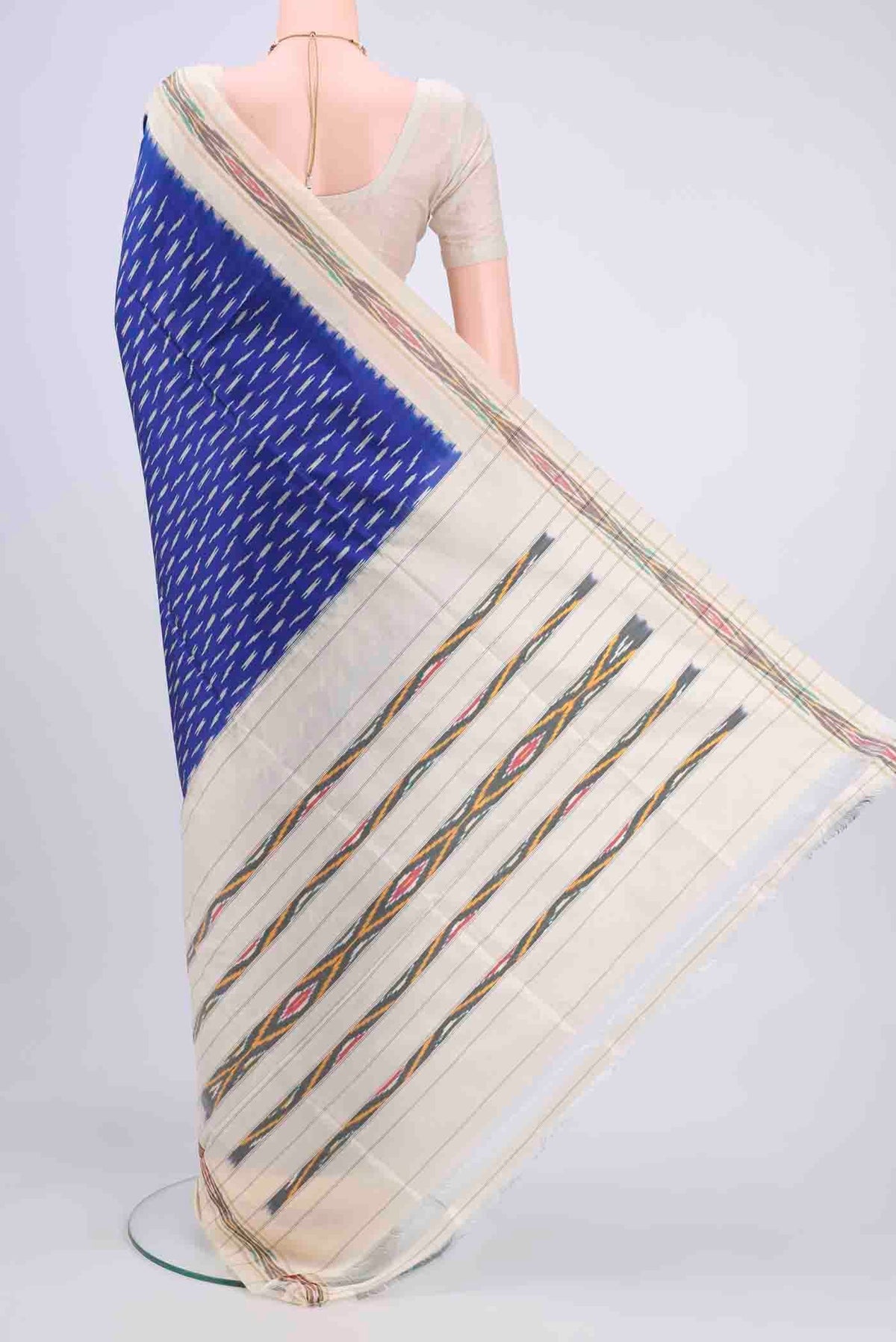 Flat view of Dark Blue Pochampally Saree with Ikat design on the body and Ikat Border
