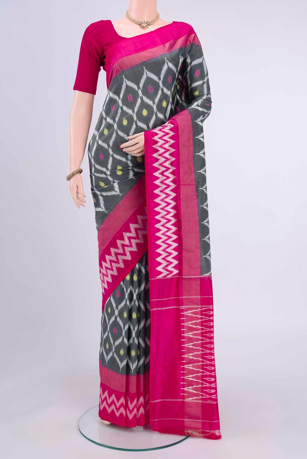Grey Pochampally Saree with Plain Body and Ikat Border displayed on a mannequin