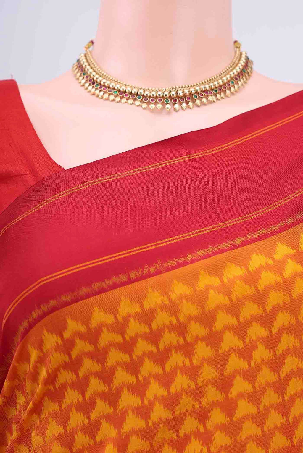 Border image of Orange Pochampally Silk Saree with Pure Ikat on the body and Plain Border