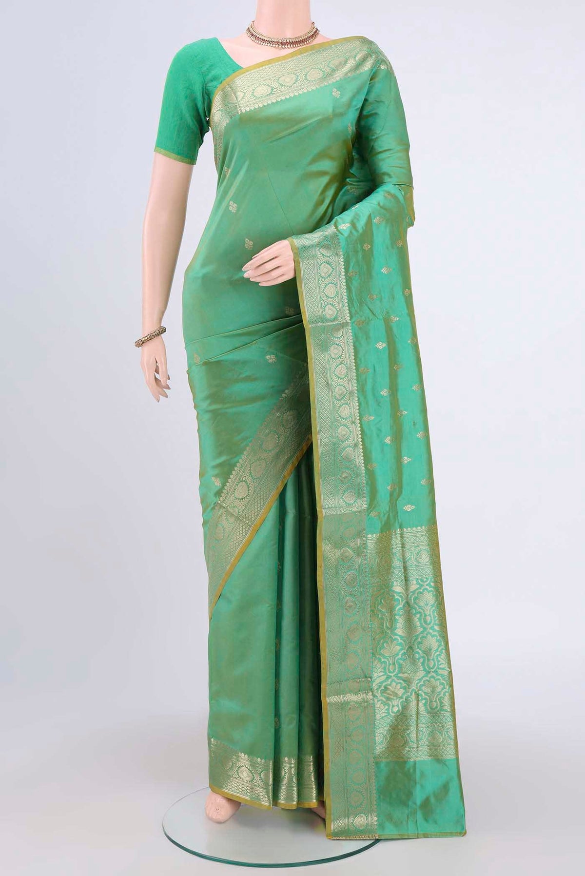 Acid Green Dual Tone Banarasi Katan Silk Saree with Zari Butta on the body and Zari Border.  displayed on a mannequin
