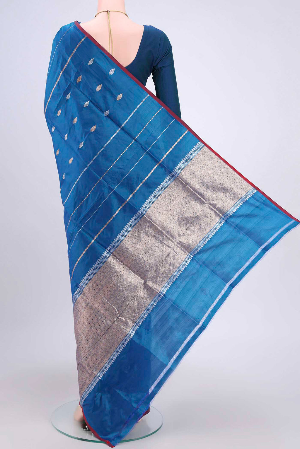 Flat view of Blue Dual Tone Banarasi Katan Silk Saree with Zari Butta on the body and Zari Border. 