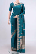 Sea Green Banarasi Katan Silk Saree with Zari Butta on the body and Zari Border.  displayed on a mannequin