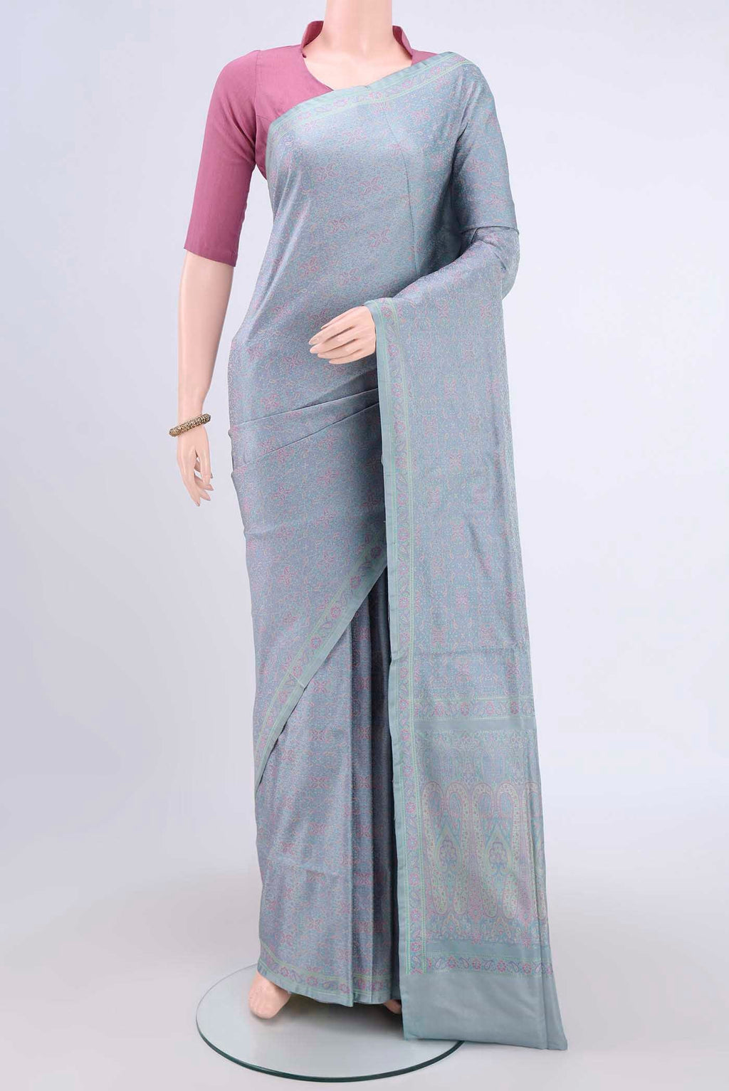 Sky Blue Banarasi Tanchoi Silk Saree with Thread Brocade on the body and Thread Border.  displayed on a mannequin