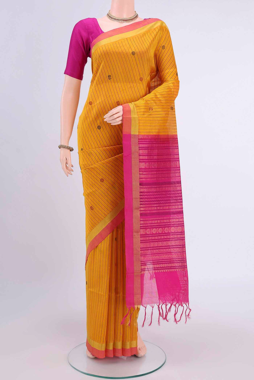 Yellow Blended Coimbatore Silk Cotton Saree with Stripes on the body and Plain Border displayed on a mannequin