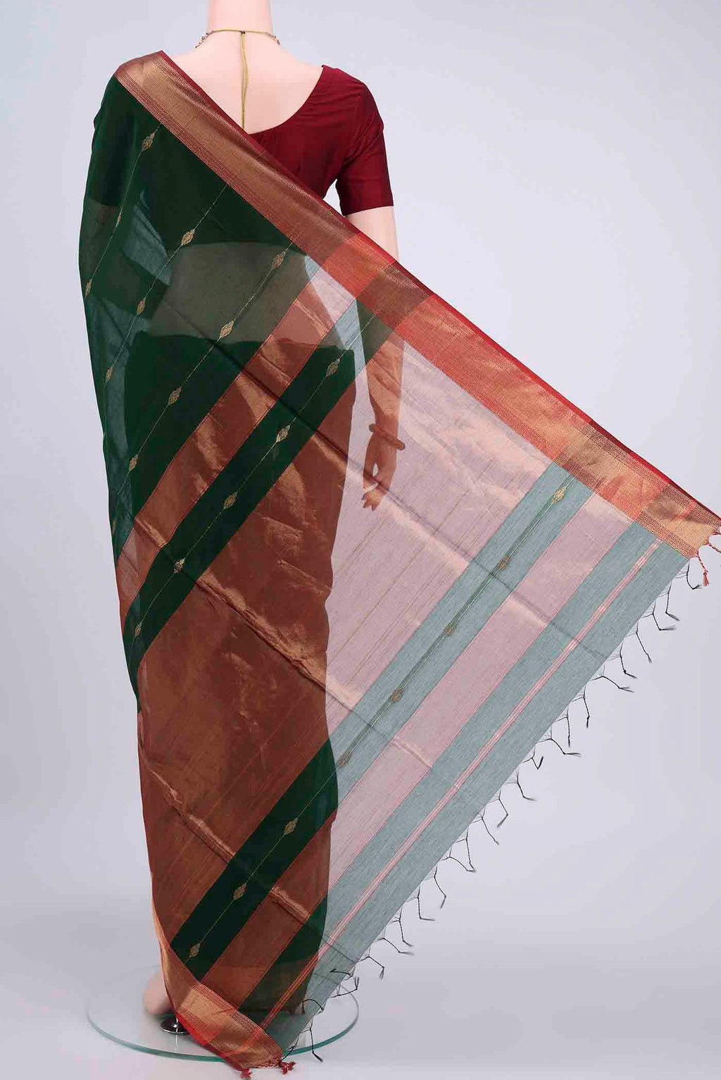 Flat view of Bottle Green Maheshwari Silk Cotton Saree with Zari Butta on the body and Zari Border
