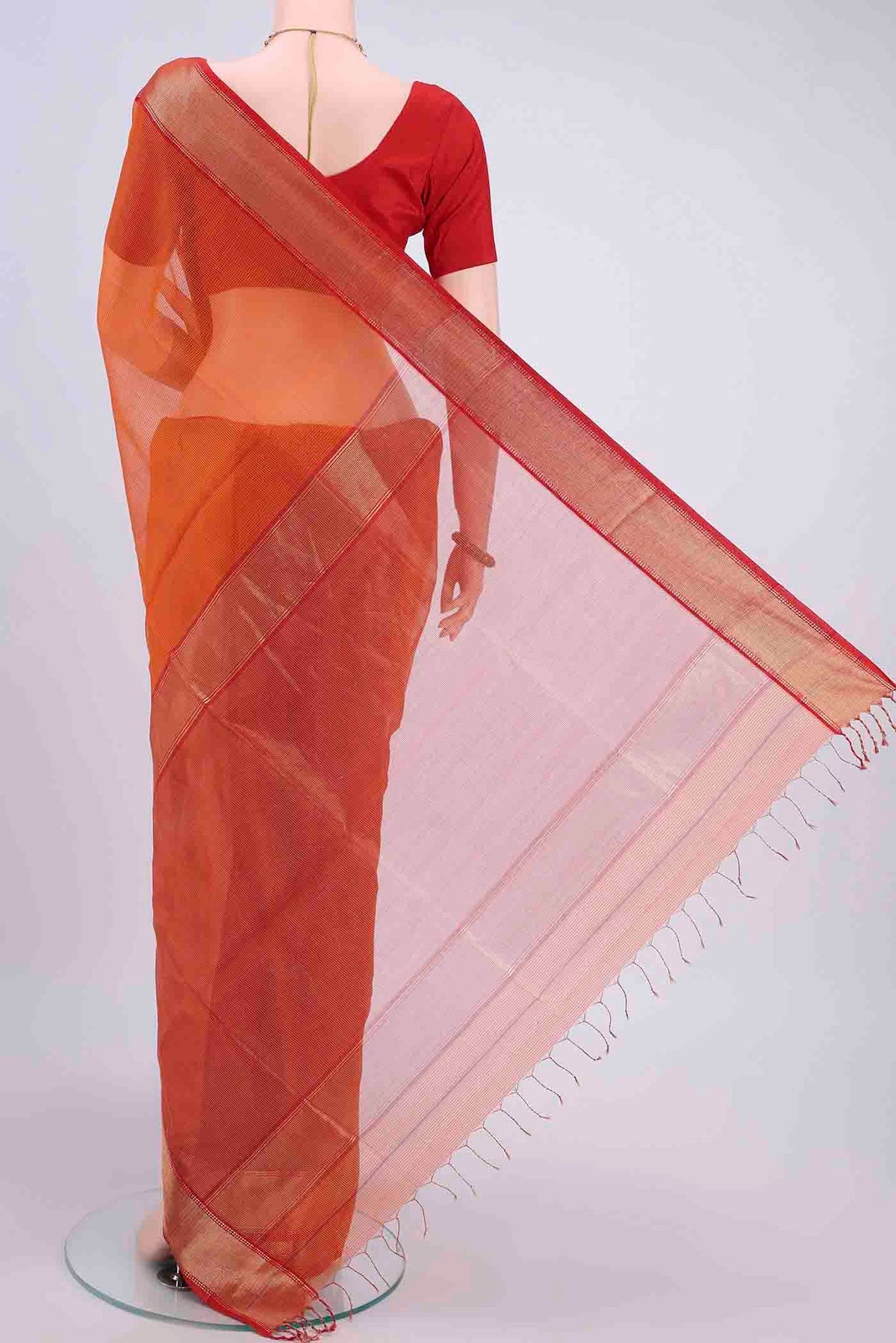 Flat view of Orange Maheshwari Silk Cotton Saree with Checked design on the body and Zari Border