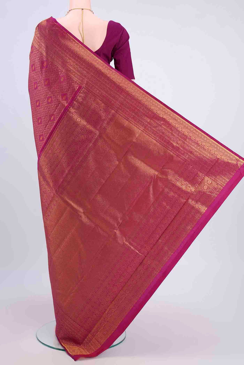 Flat view of Magenta Kanchipuram Silk Saree with Zari Brocade on the body and Zari Border