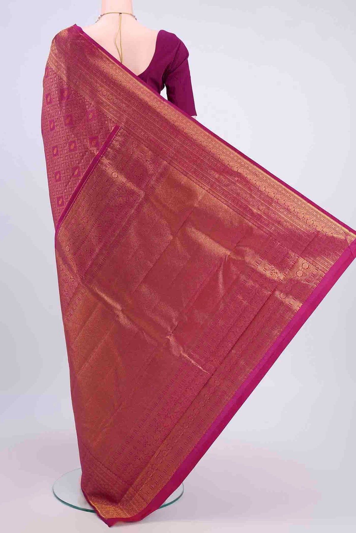 Flat view of Magenta Kanchipuram Silk Saree with Zari Brocade on the body and Zari Border