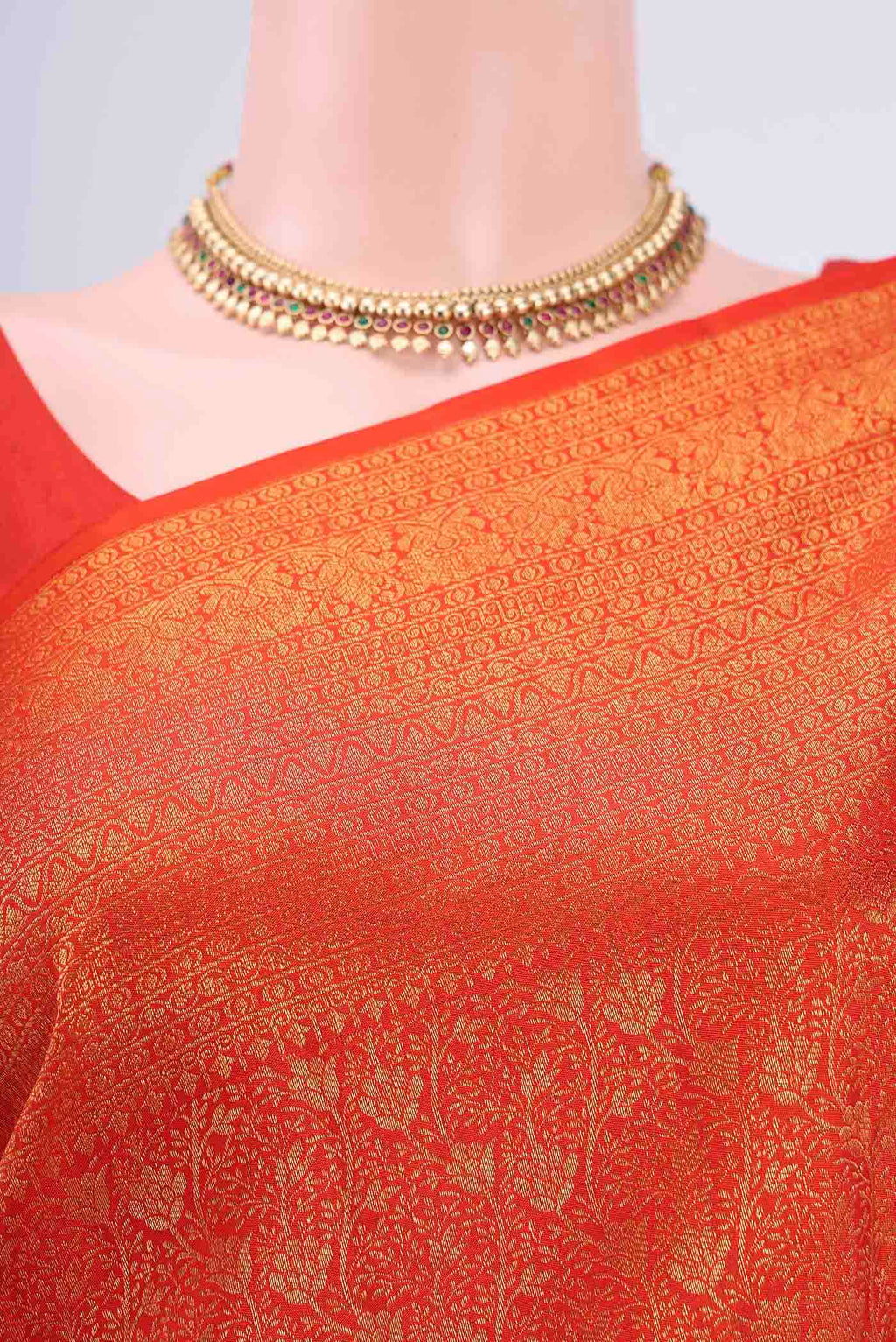 Border image of Orange Kanchipuram Silk Saree with Zari Brocade on the body and Zari Border