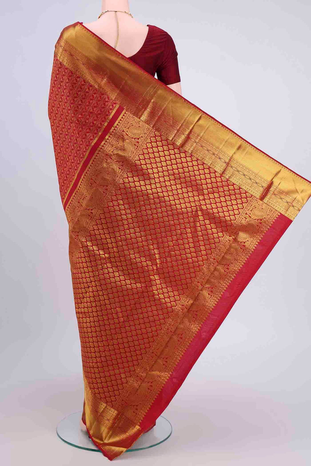 Flat view of Red Kanchipuram Silk Saree with Zari Brocade on the body and Zari Border