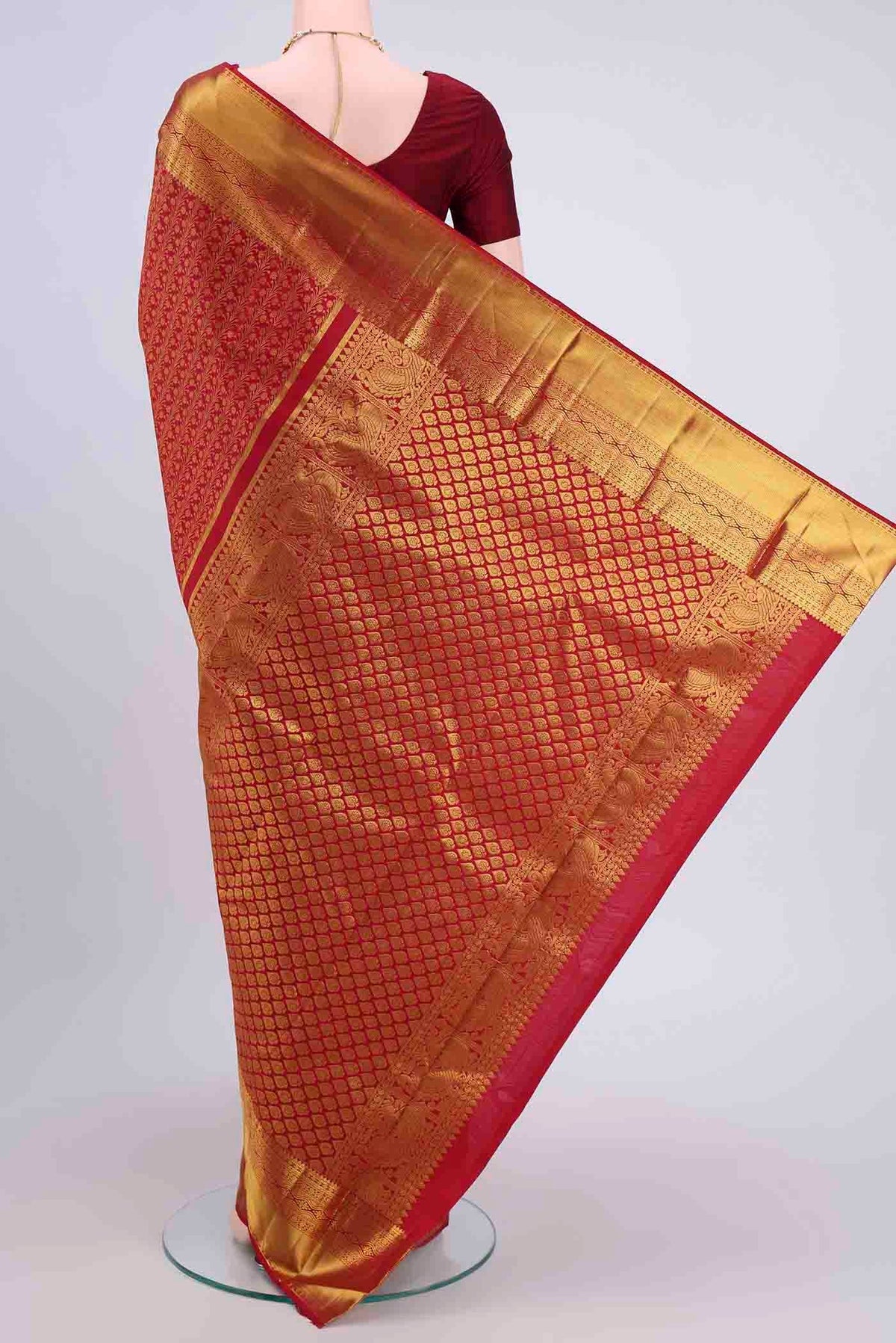 Flat view of Red Kanchipuram Silk Saree with Zari Brocade on the body and Zari Border