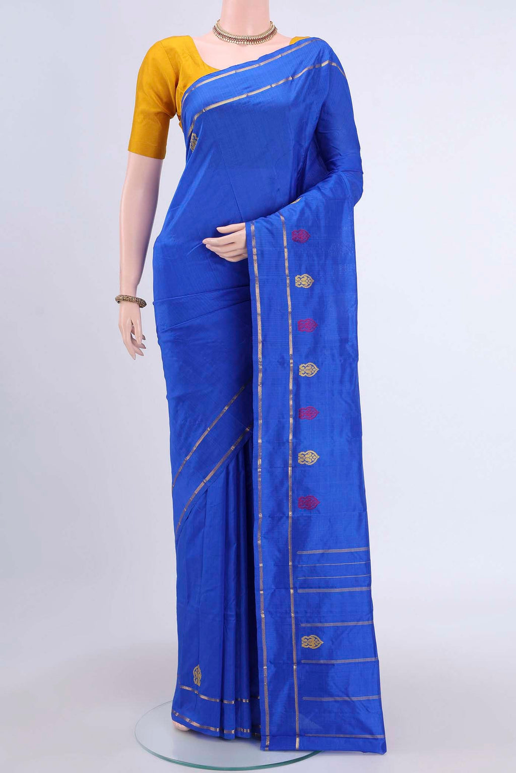 Royal Blue Kanchipuram Silk Saree with Plain Body and Zari And Thread Border displayed on a mannequin
