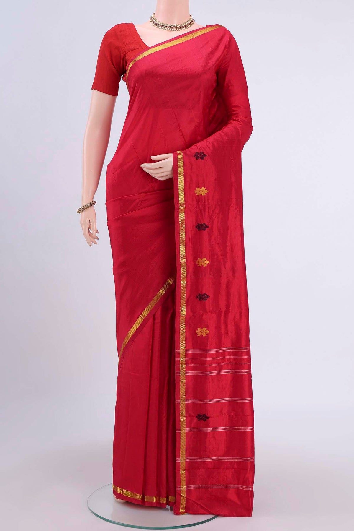 Deep Red Kanchipuram Silk Saree with Plain Body and Zari Border displayed on a mannequin