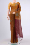 Mustard Kora Cotton Saree with Zari Butta on the body and Zari Border.  displayed on a mannequin