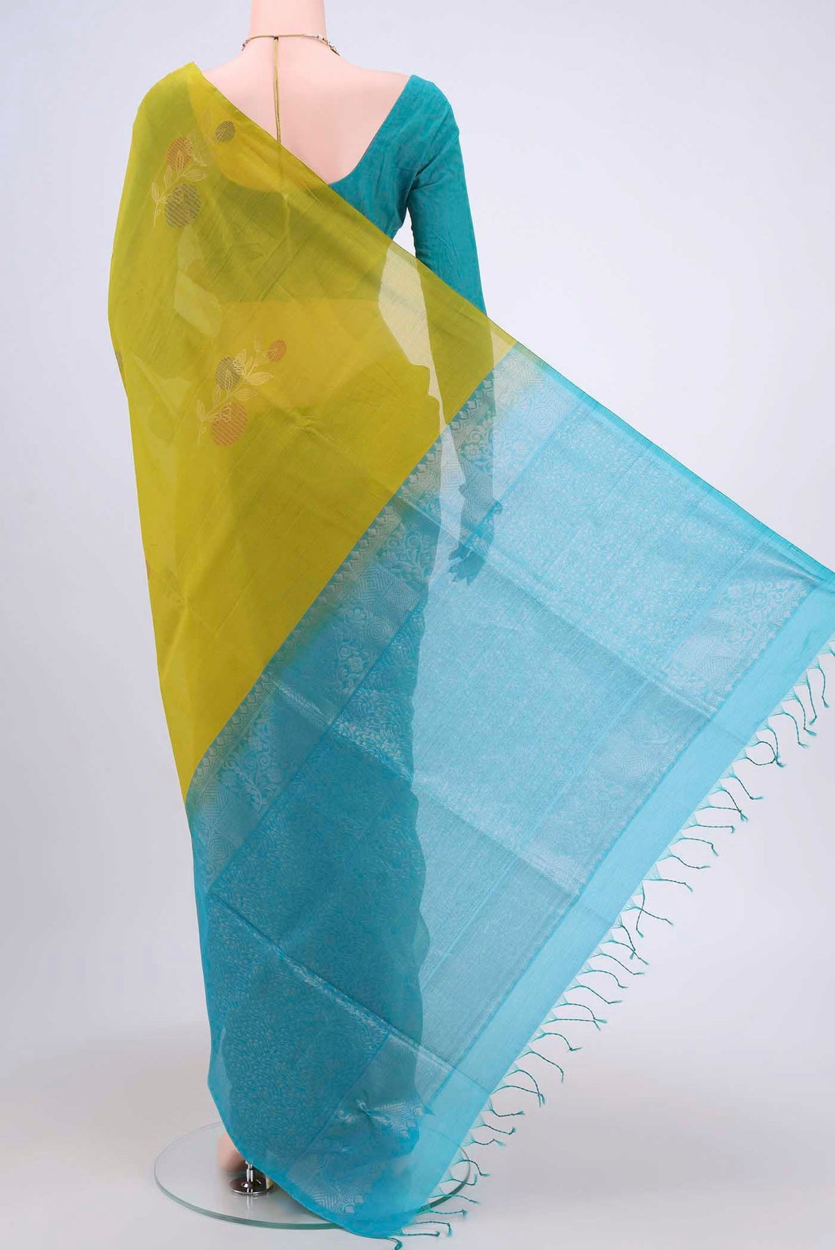 Flat view of Acid Green Kora Cotton Saree with Zari Butta on the body and Zari Border. 