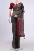 Grey Kora Cotton Saree with Zari Butta on the body and Zari Border.  displayed on a mannequin