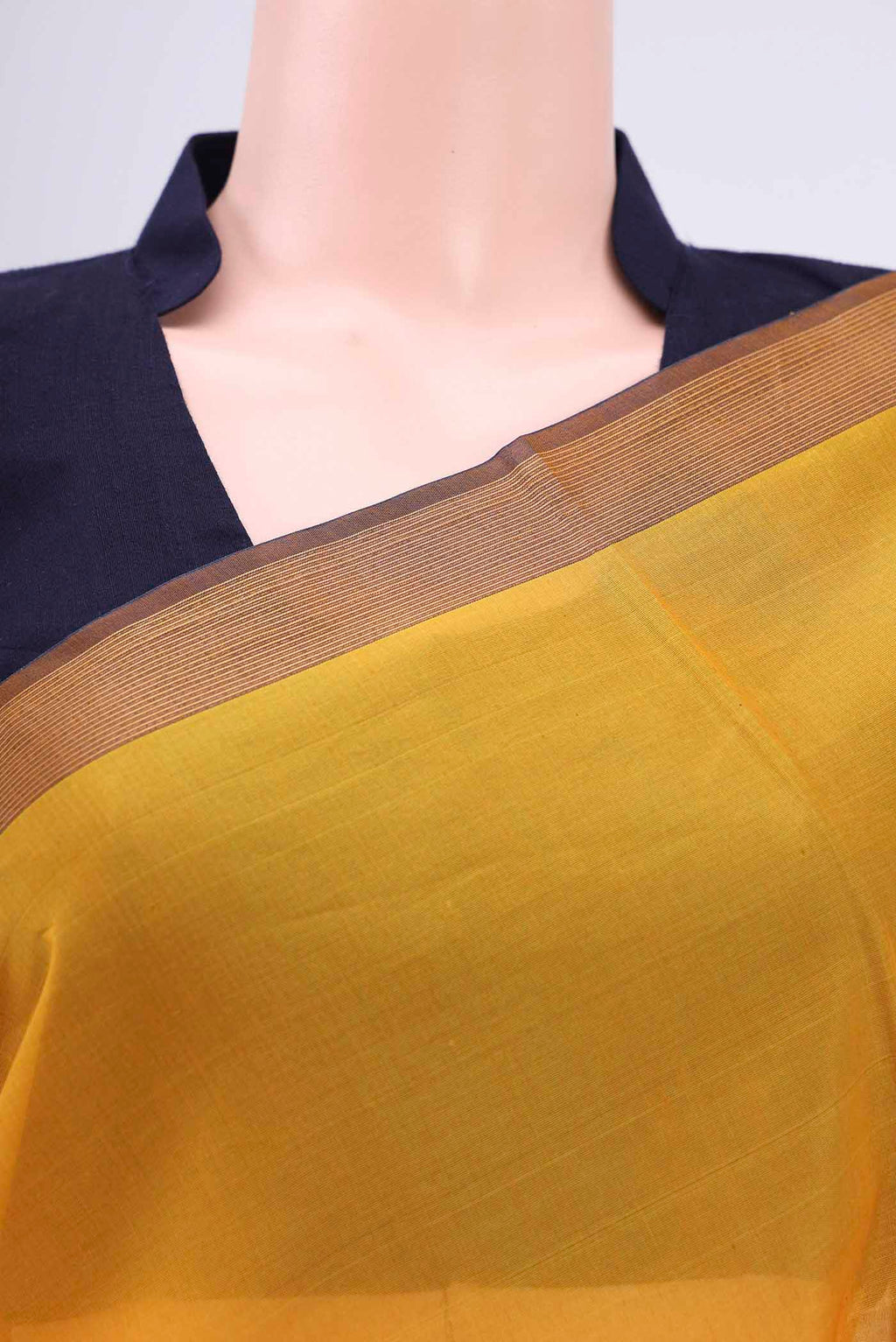 Border image of Mustard Kora Cotton Saree with Zari Butta on the body and Plain Border. 