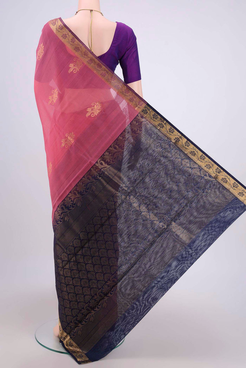 Flat view of Pink Silk Cotton Saree with Zari Butta on the body and Zari Border. 