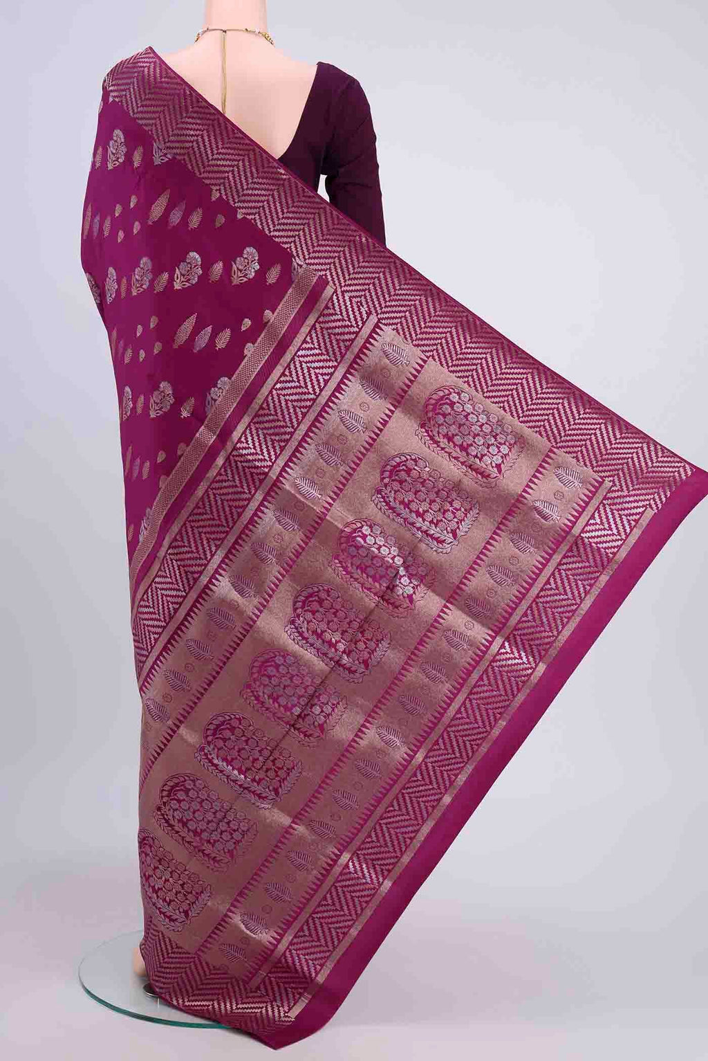 Flat view of Magenta Soft Silk Saree with Zari Butta on the body and Fancy Border