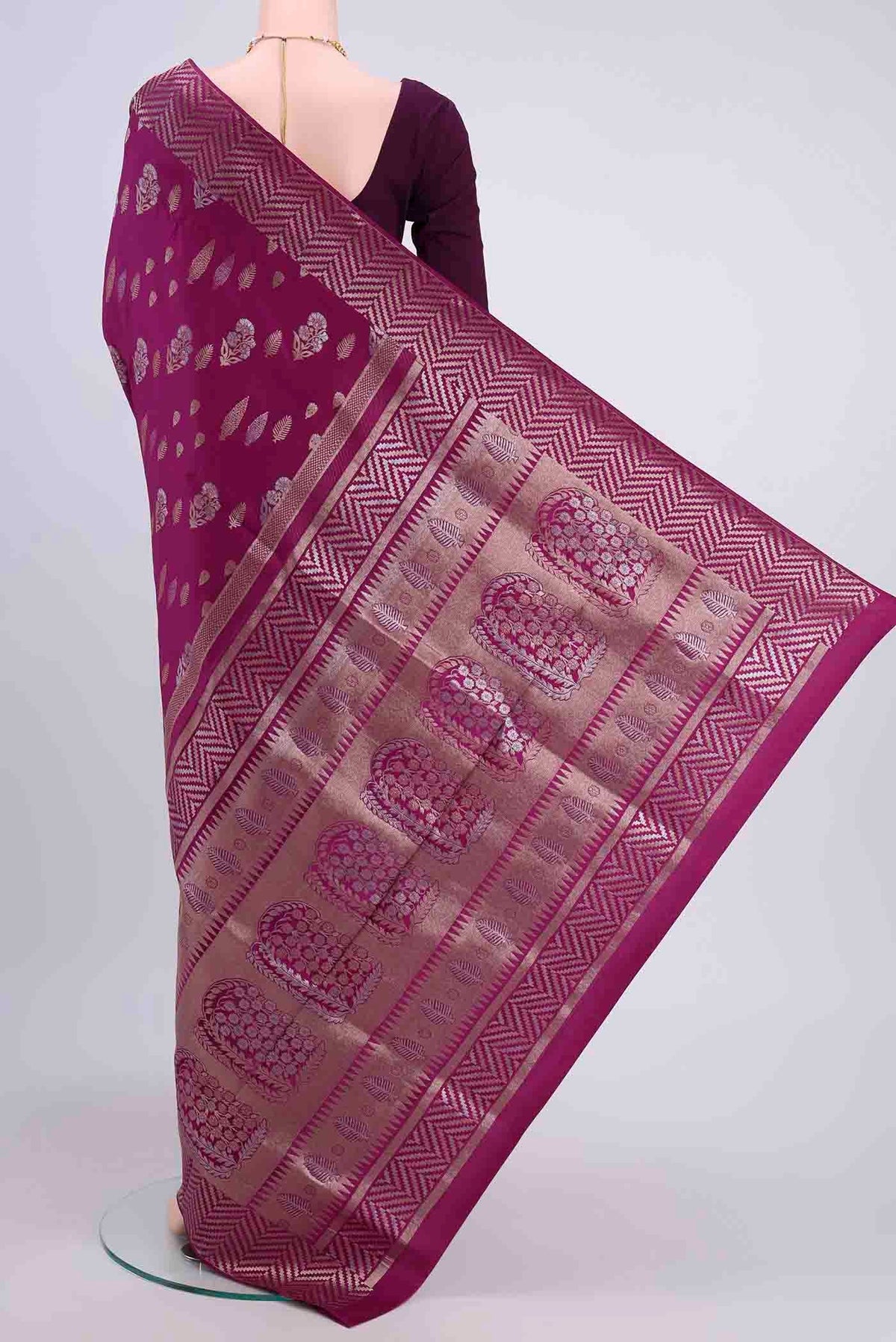 Flat view of Magenta Soft Silk Saree with Zari Butta on the body and Fancy Border