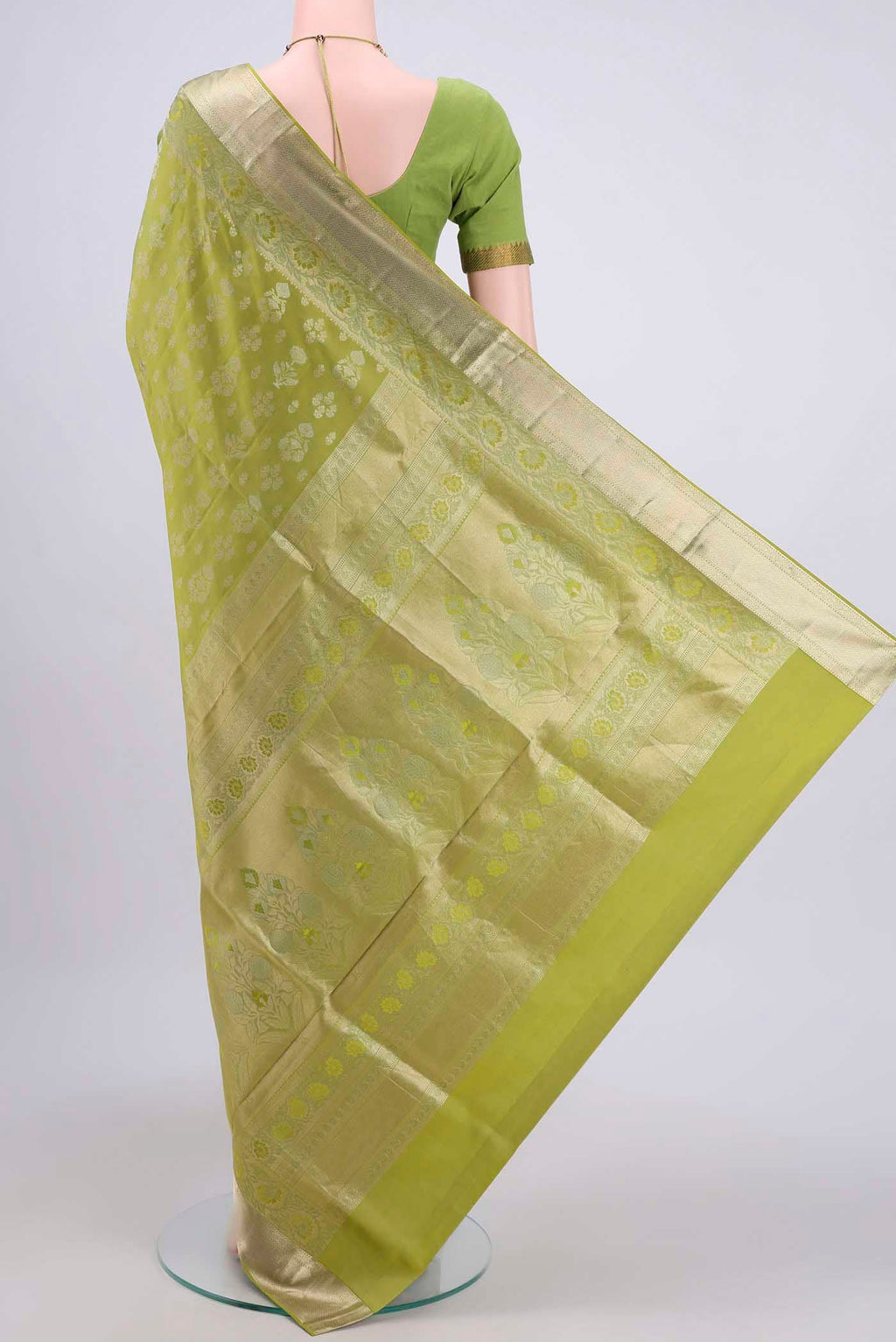 Flat view of Light Green Soft Silk Saree with Zari Butta on the body and Zari Border