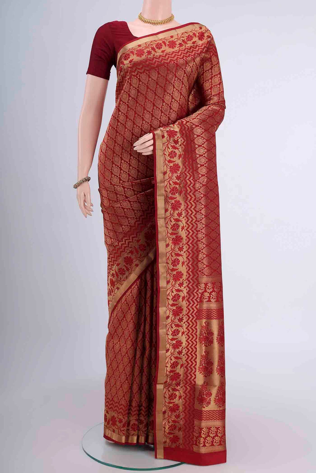 Maroon Soft Silk Saree with Zari Brocade on the body and Zari Border displayed on a mannequin