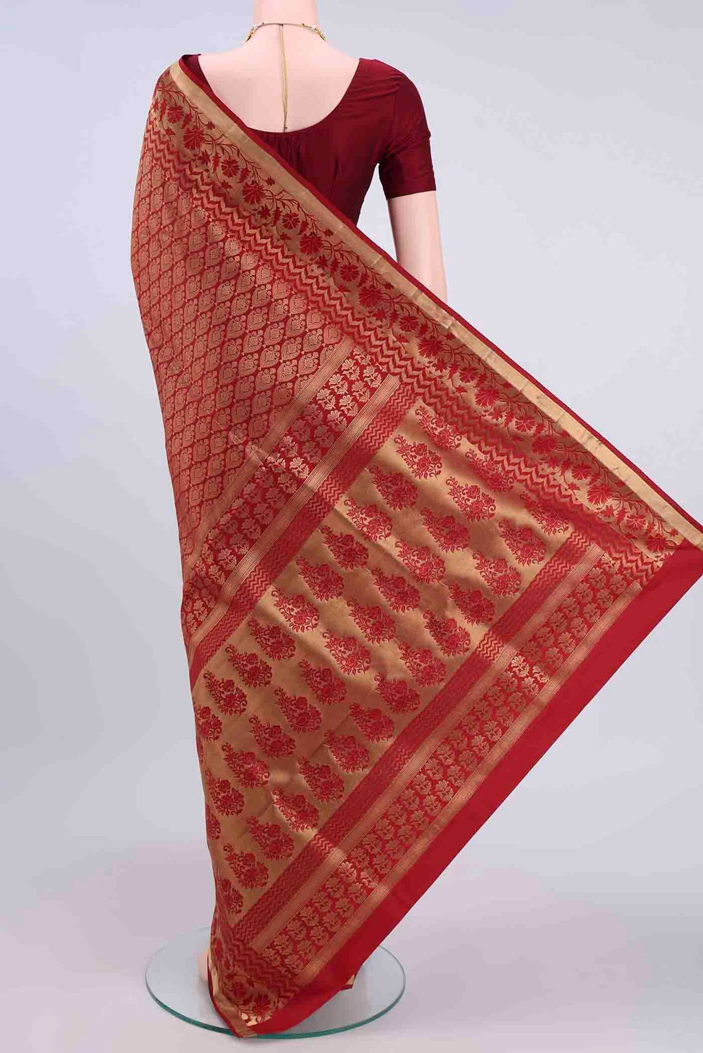 Flat view of Maroon Soft Silk Saree with Zari Brocade on the body and Zari Border