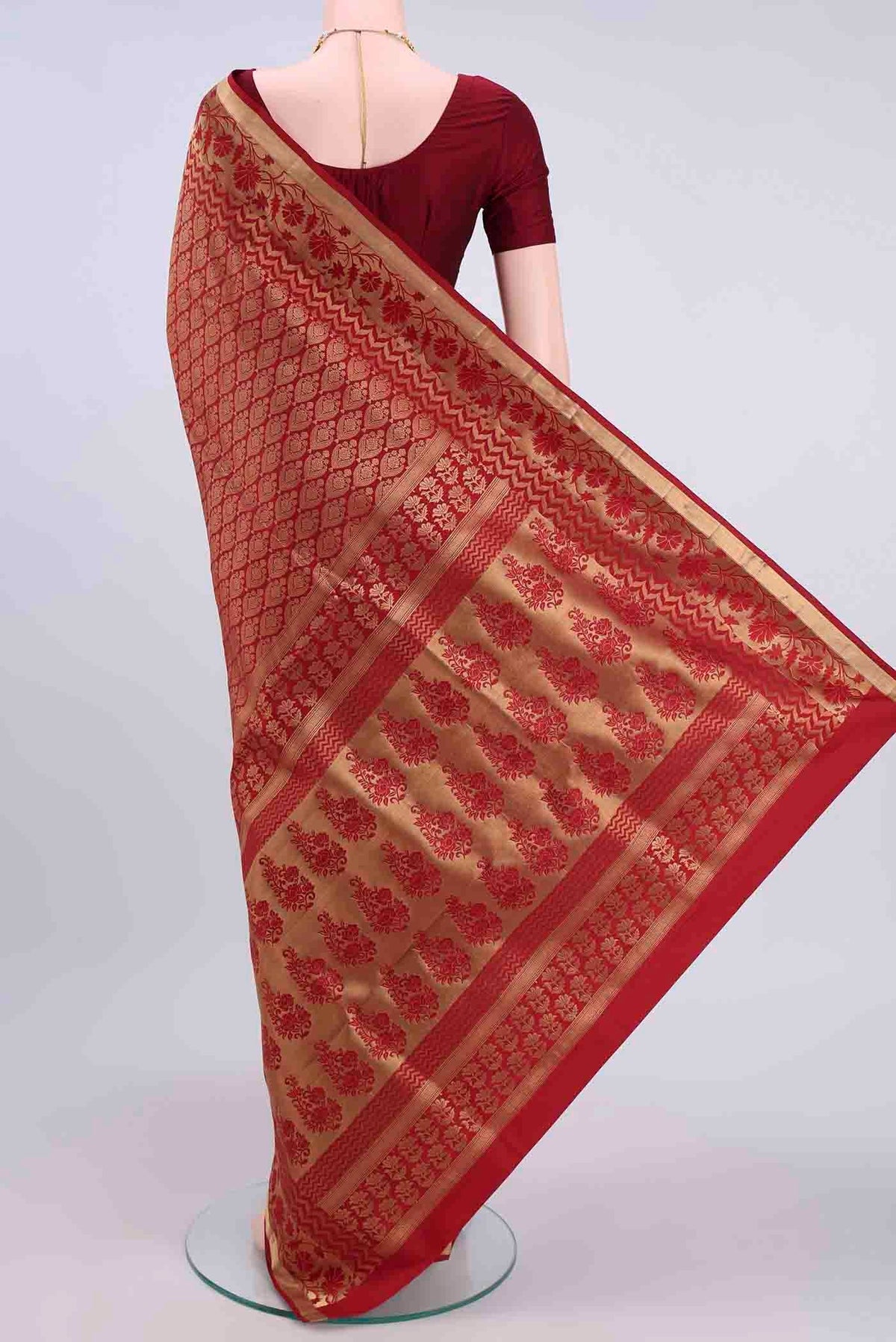 Flat view of Maroon Soft Silk Saree with Zari Brocade on the body and Zari Border