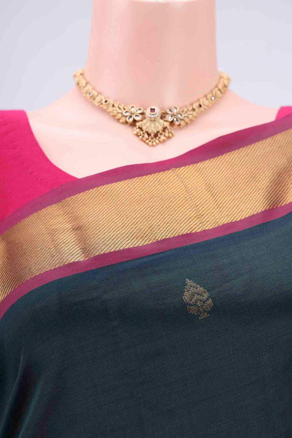 Border image of Bottle Green Blended Poly Cotton Saree with Zari Butta on the body and Thread Border. 