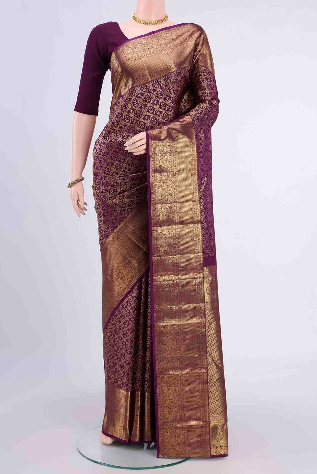 Purple Kanchipuram Silk Saree with Zari Brocade on the body and Zari Border displayed on a mannequin