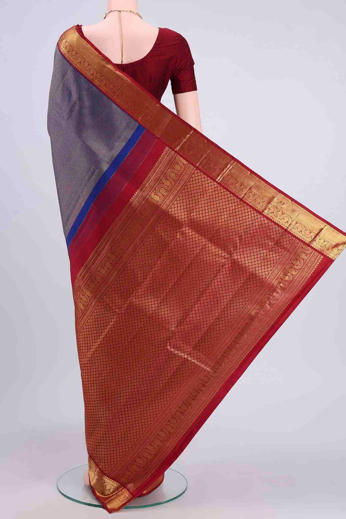 Flat view of Navy Blue Kanchipuram Silk Saree with Zari Brocade on the body and Zari Border