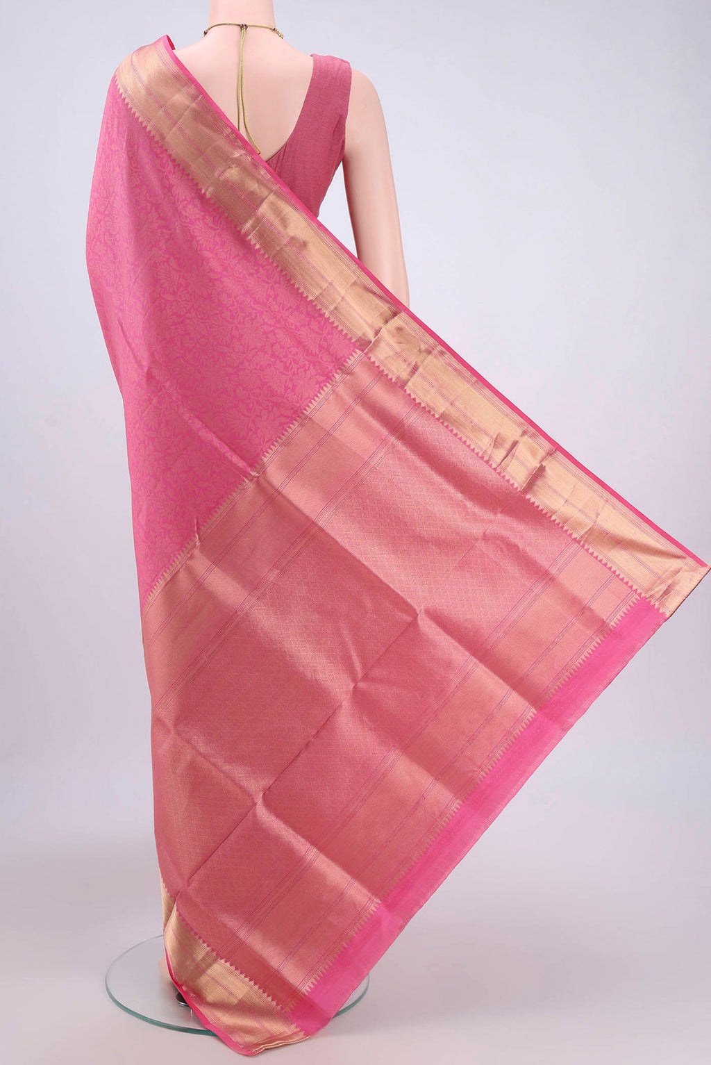 Flat view of Pink Soft Silk Saree with Zari Brocade on the body and Zari Border. 