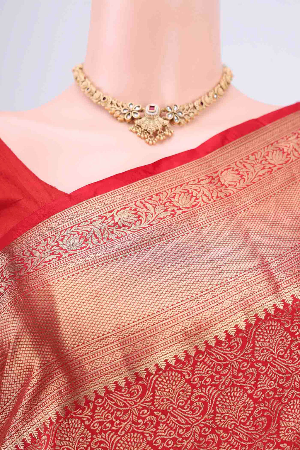 Border image of Red Soft Silk Saree with Zari Brocade on the body and Zari Border. 