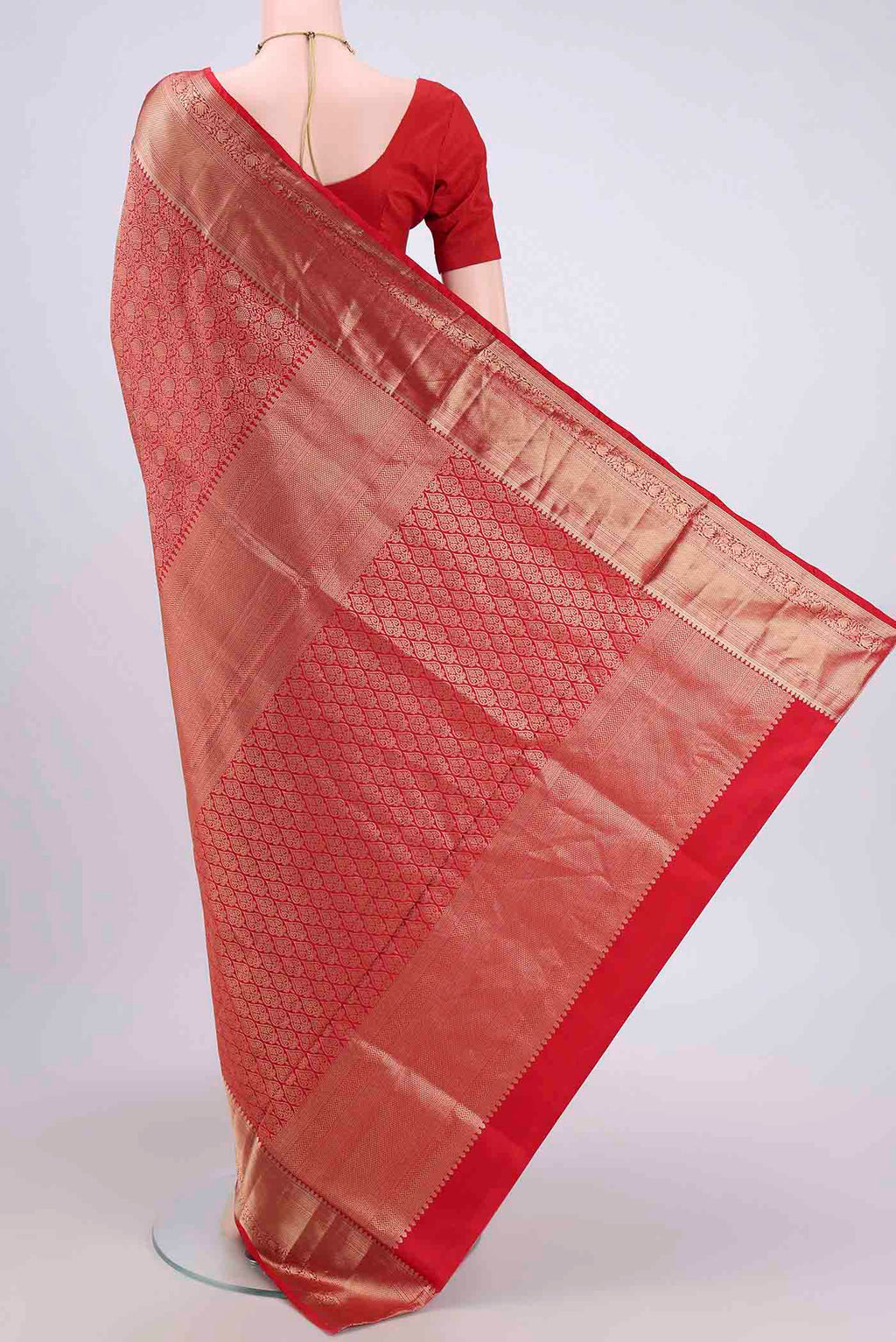Flat view of Red Soft Silk Saree with Zari Brocade on the body and Zari Border. 