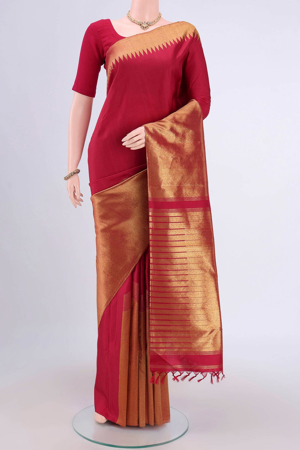 Maroon Dual Tone Kanjivaram Saree with Plain Body and Fancy Border.  displayed on a mannequin