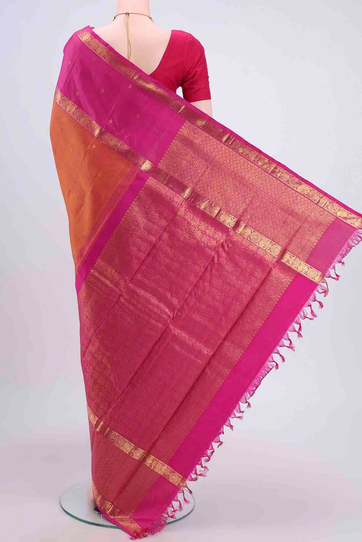 Flat view of Brick Orange Kanchipuram Saree with Zari Butta on the body and Zari Border