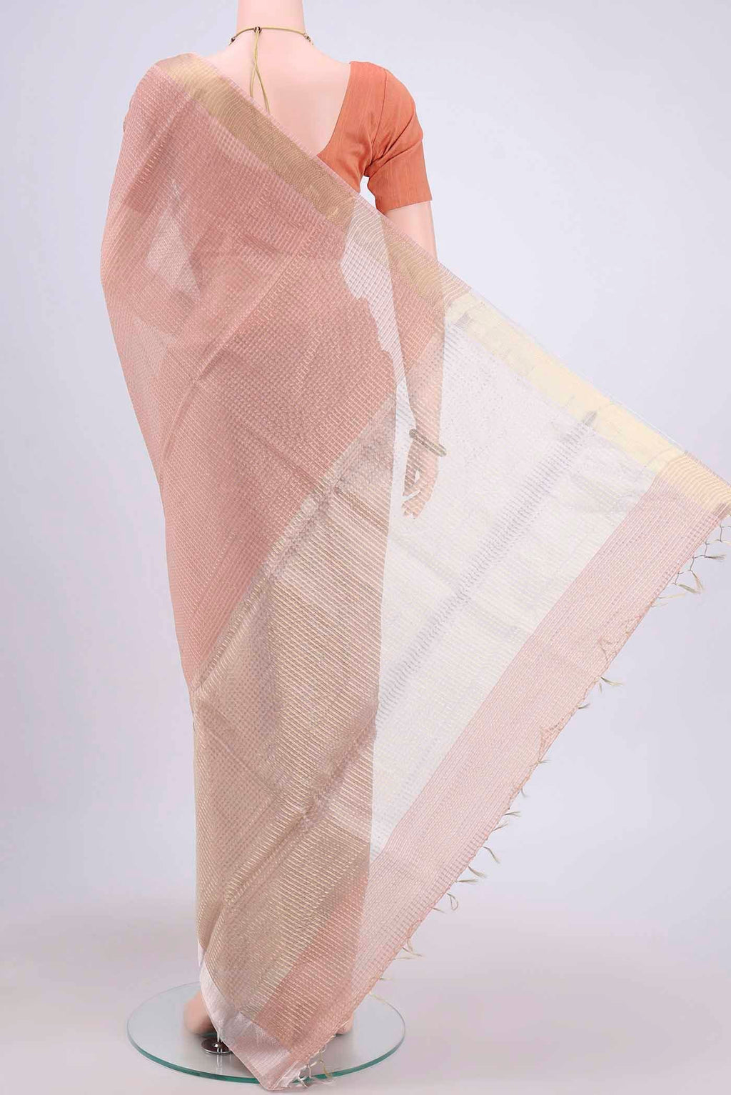 Flat view of Peach Tussar Silk Saree with Checked design on the body and Plain Border. 