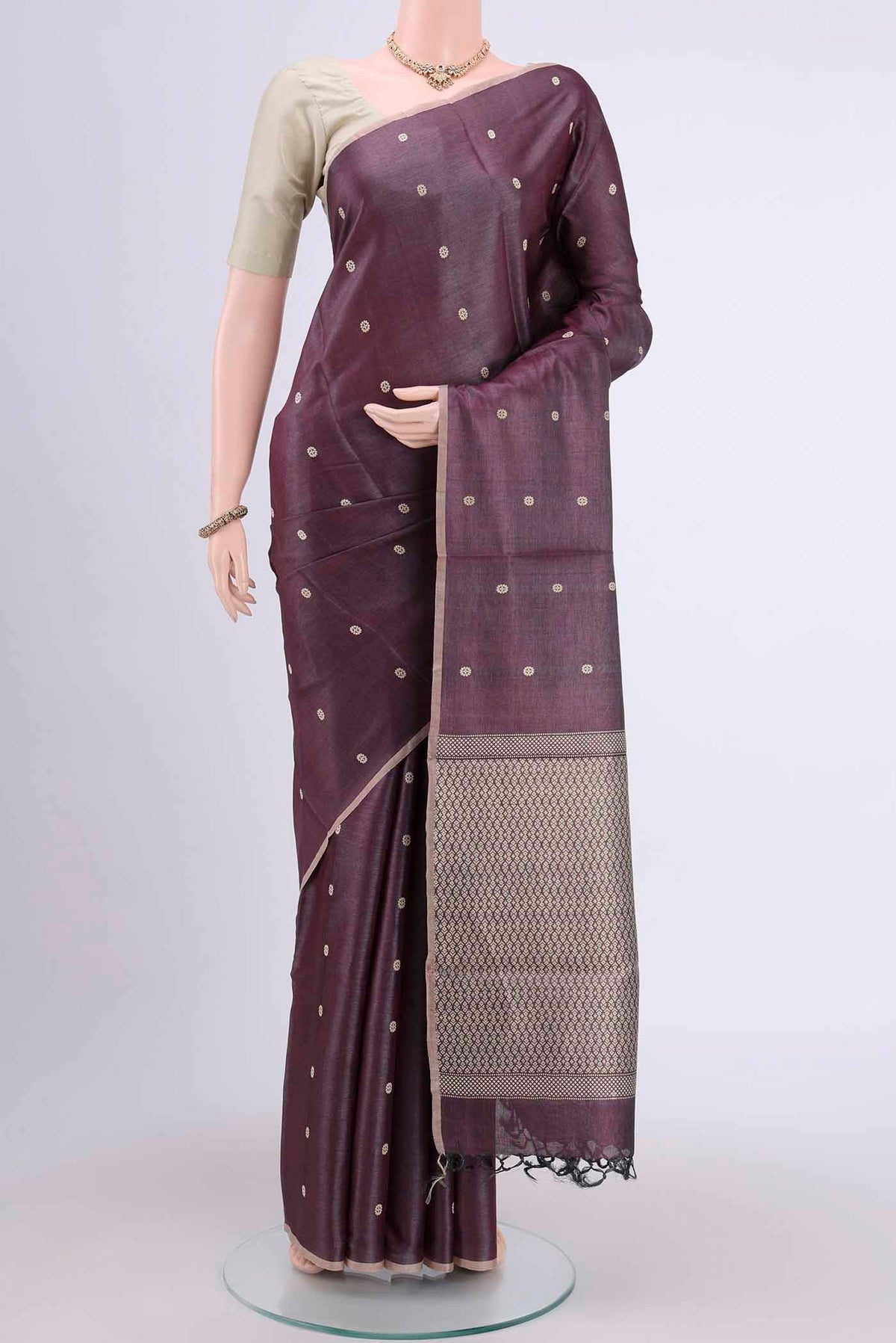 Dark Mauve Tussar Silk Saree with Thread Butta on the body and Plain Border displayed on a mannequin