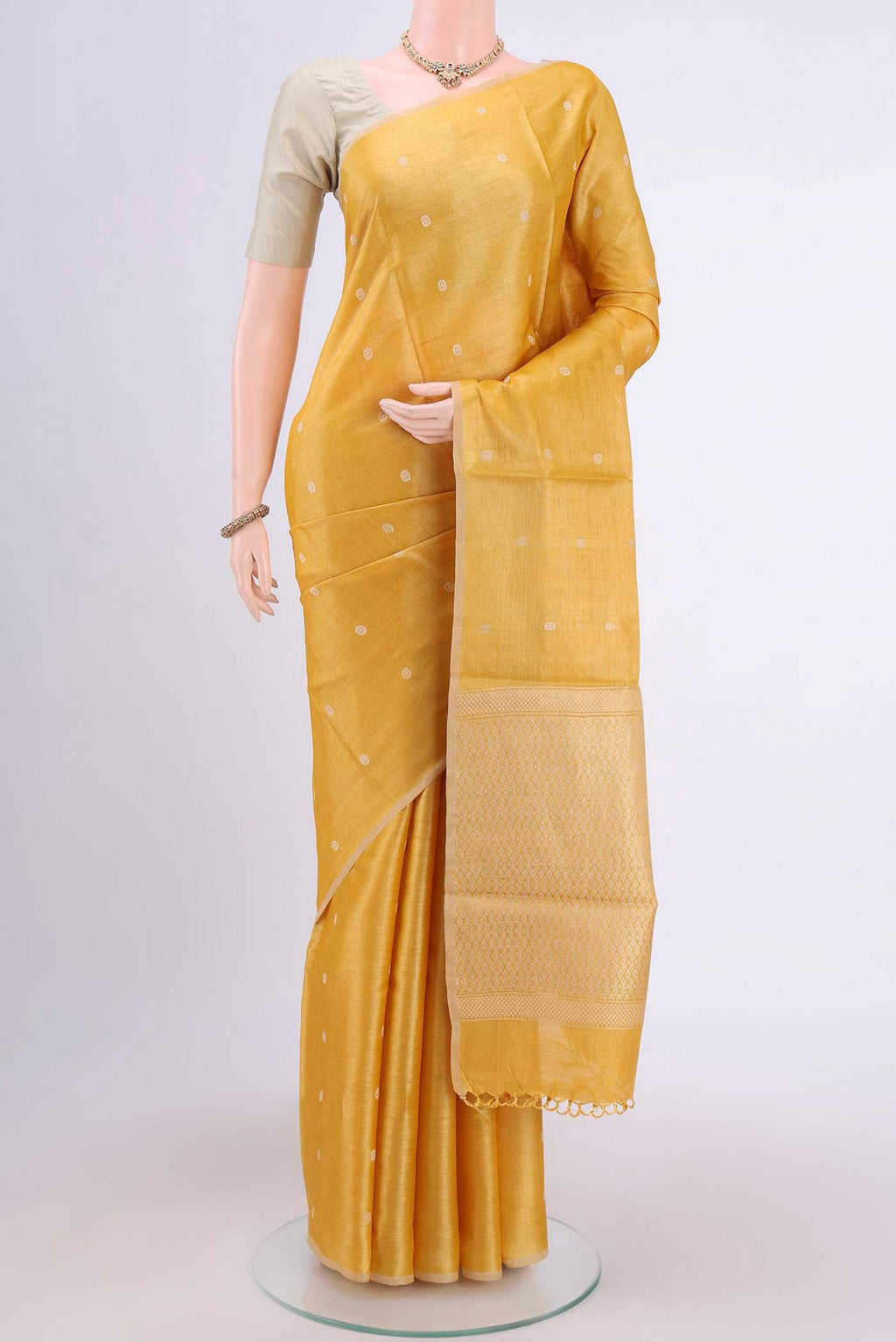 Lemon Yellow Tussar Silk Saree with Thread Butta on the body and Plain Border displayed on a mannequin