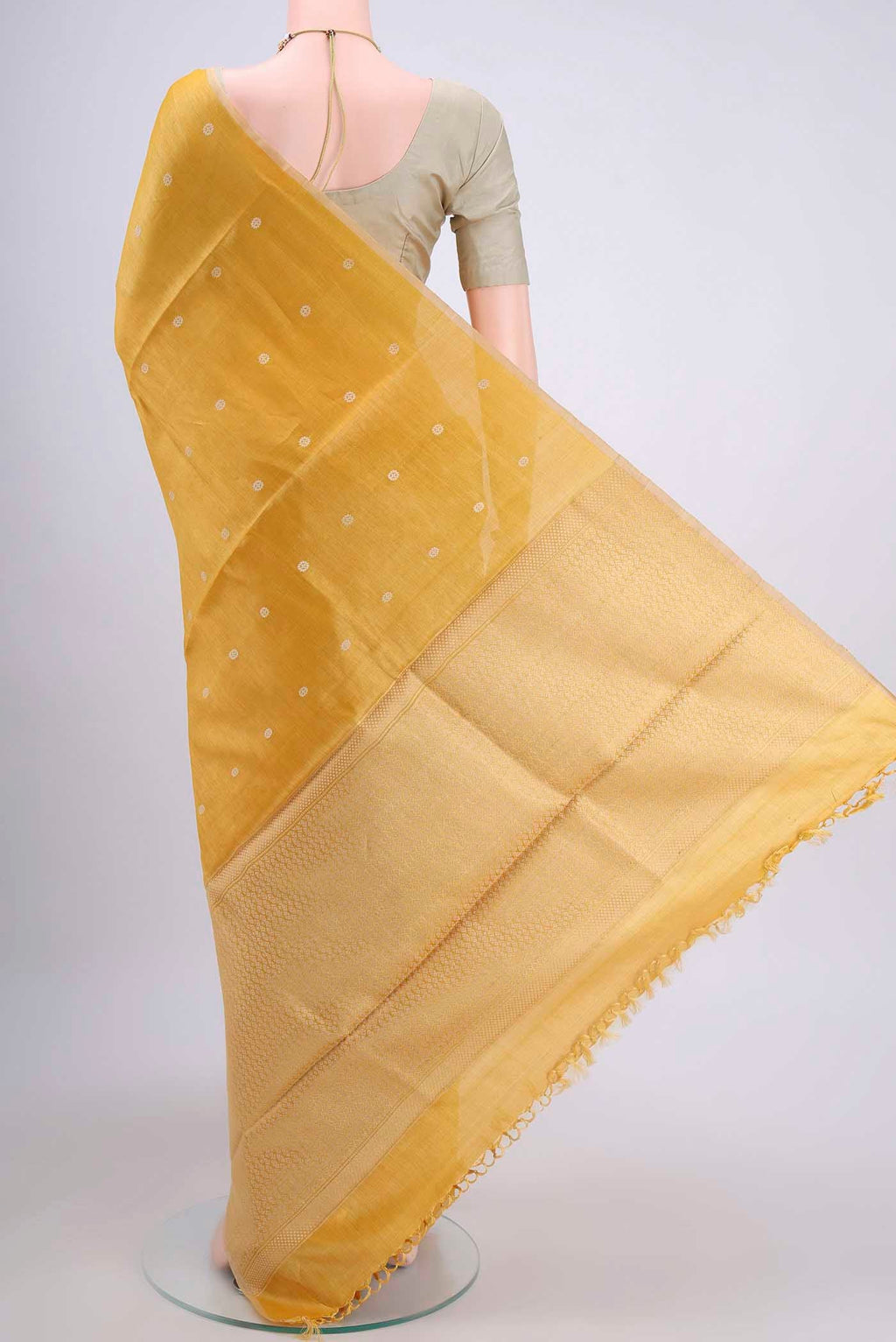 Flat view of Lemon Yellow Tussar Silk Saree with Thread Butta on the body and Plain Border