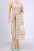 Beige Tussar Silk Saree with Zari And Thread Butta on the body and Thin Zari Line.  displayed on a mannequin