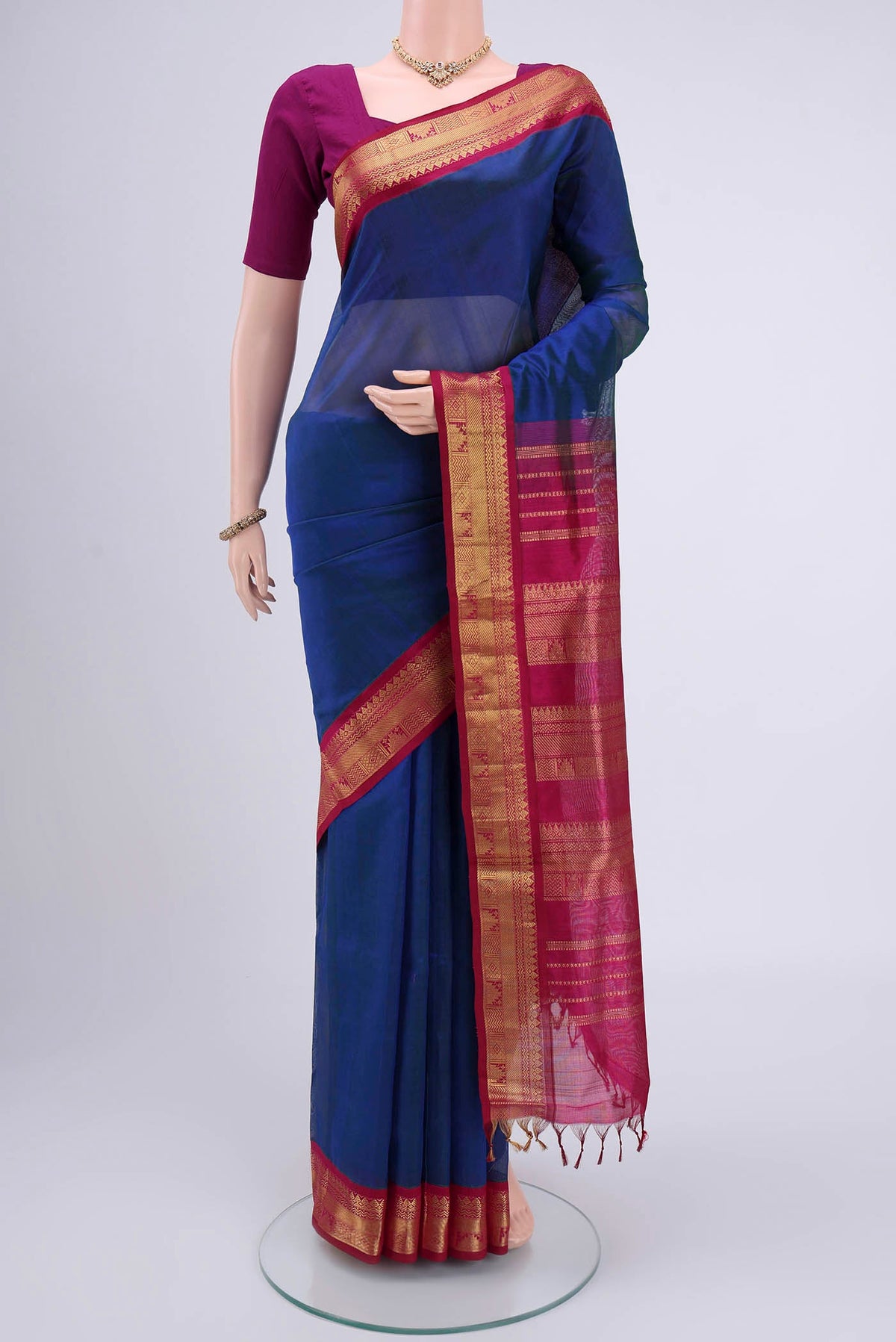 Peacock Blue Blended Coimbatore Silk Cotton Saree with Plain Body and Zari Border.  displayed on a mannequin