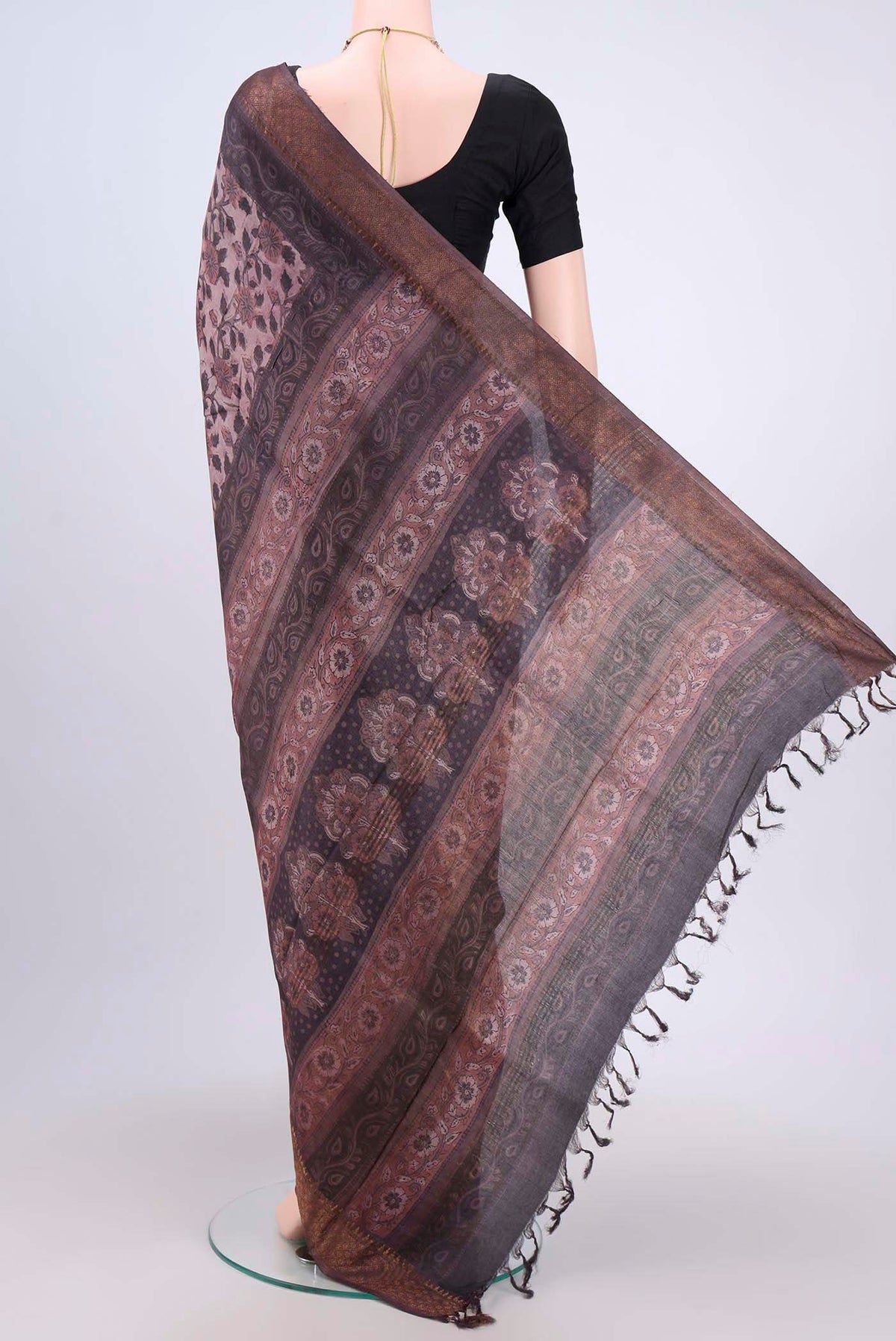 Flat view of Brown Tussar Silk Saree with Floral Print on the body and Zari Border. 