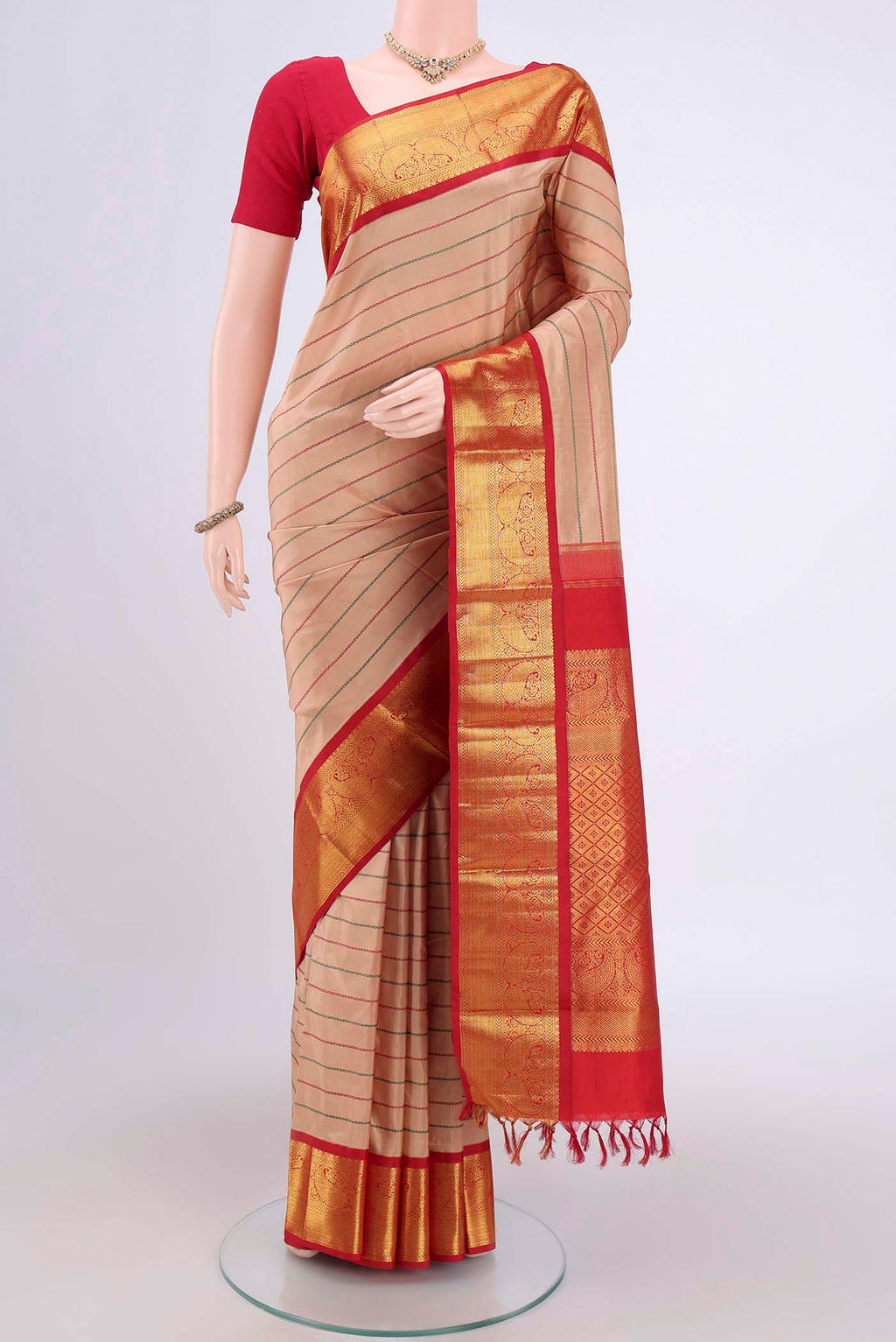 Beige Dual Tone Kanjivaram Silk Saree with Stripes on the body and Zari Border.  displayed on a mannequin