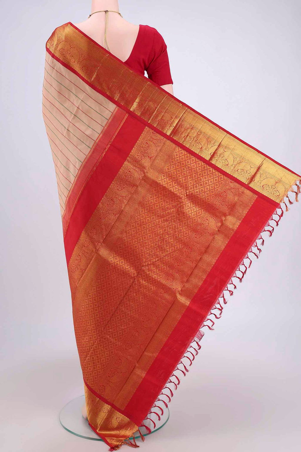 Flat view of Beige Dual Tone Kanjivaram Silk Saree with Stripes on the body and Zari Border. 