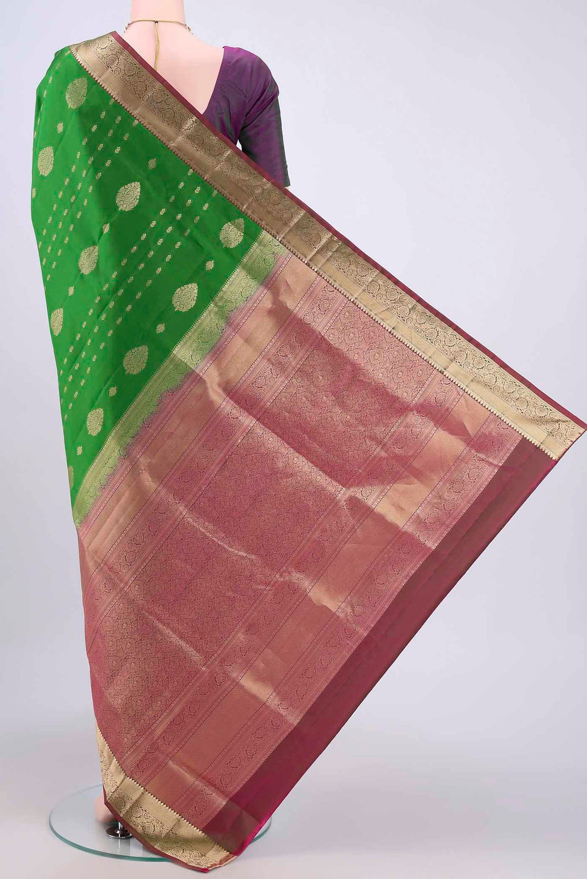 Flat view of Green Soft Silk Saree with Zari Butta on the body and Zari Border. 